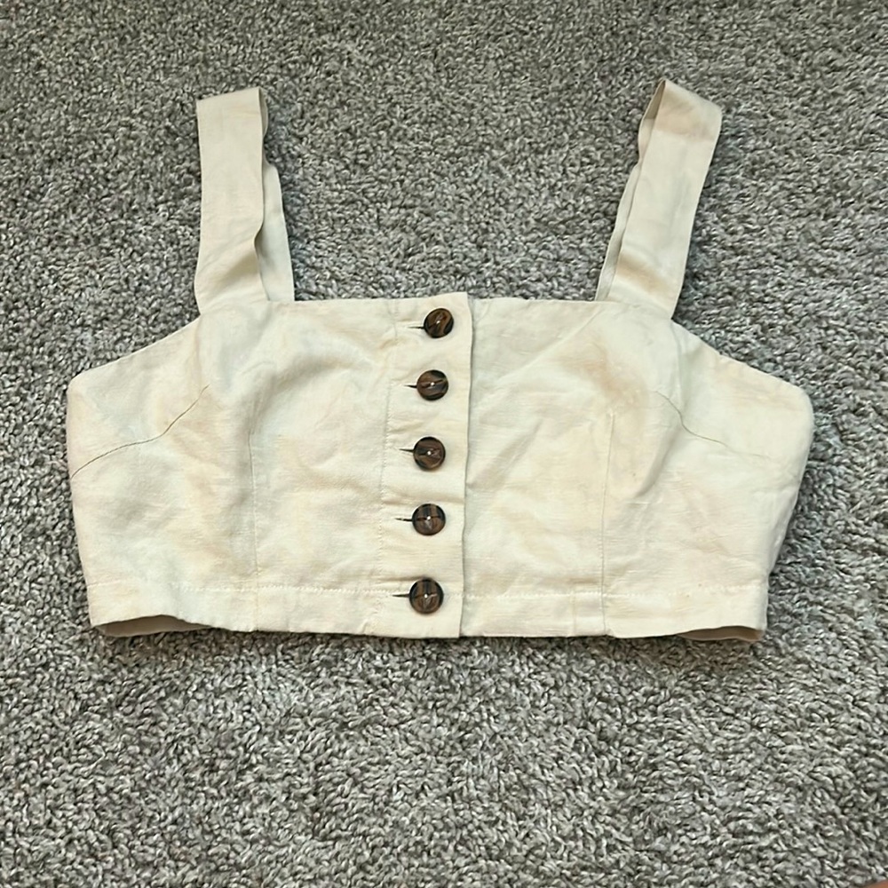 beige top with buttons that unbotton